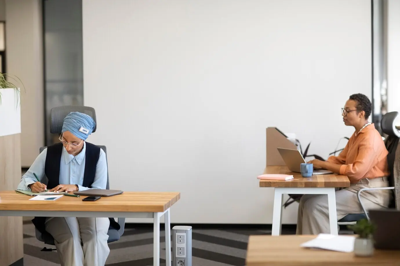 Women at a desk working in an office job